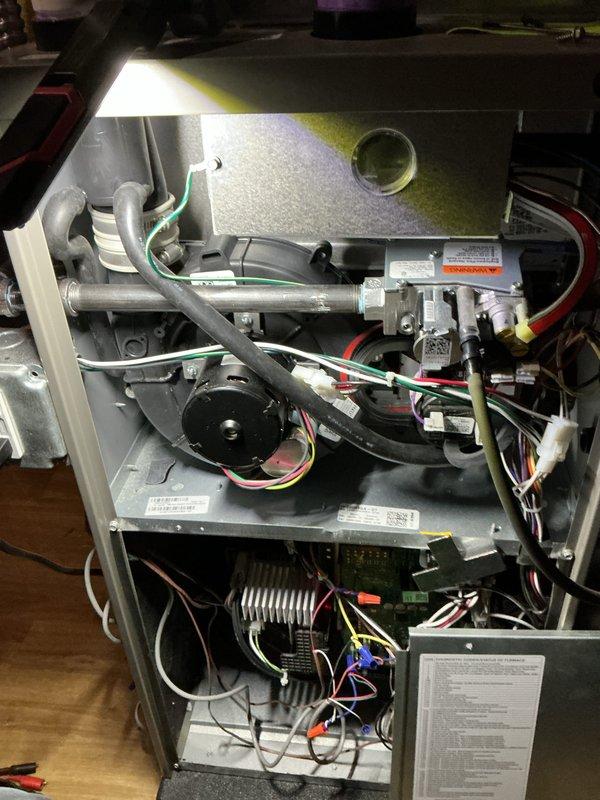 Completed comprehensive winter maintenance inspection on 2-year-old HVAC furnace system operating without reported issues. Performed full tune-up service including inspection of blower motor assembly, heat exchanger coils, electrical connections, and pressure switch components. Verified all wire terminations secure, checked gas valve operation, inspected burner assembly, and tested safety controls. Examined internal cabinet components with access panels removed to ensure proper airflow pathways and component condition. All system components found operating within normal parameters with no deficiencies noted. Unit returned to service in proper working condition.