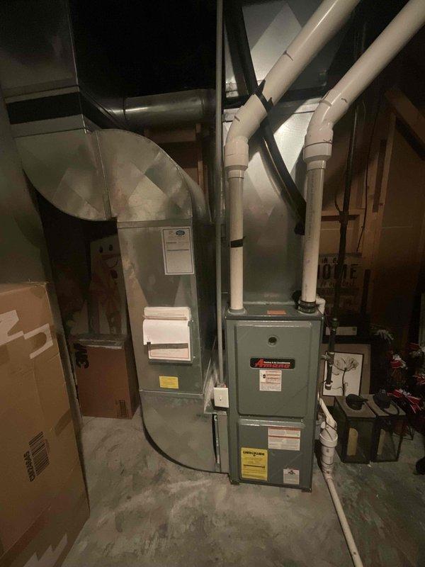 Provided comprehensive estimate for complete HVAC system replacement including both air conditioning condenser and furnace unit currently located in basement. Existing 21-year-old equipment remains operational but has reached end of expected service life, prompting evaluation for full system upgrade under buy-one-get-one promotion.