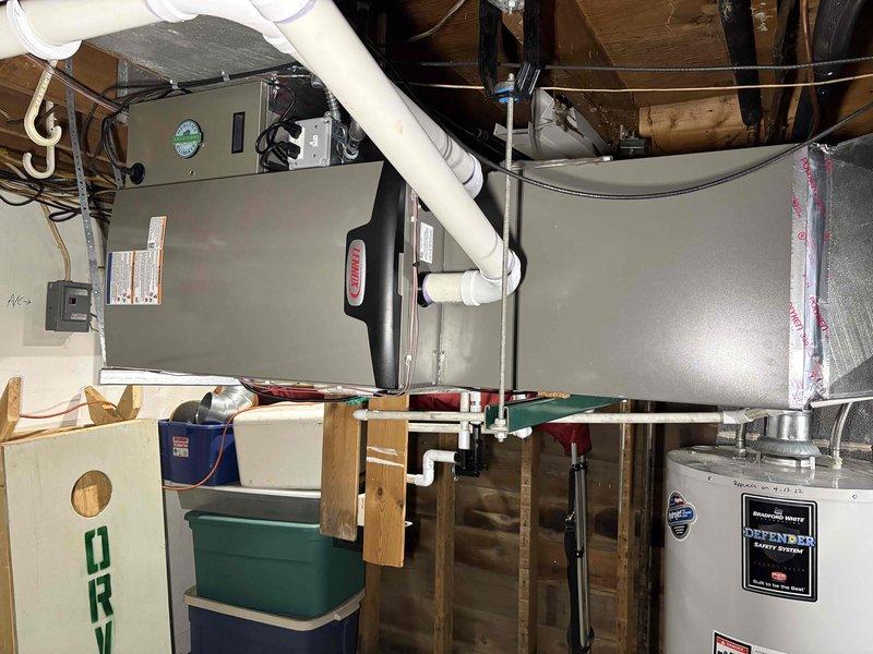 Completed full HVAC system installation including a 70,000 BTU gas furnace with humidifier and 2.5-ton air conditioning unit with matching evaporator coil configured for right-side positioning. Installed all necessary PVC venting, condensate drainage, refrigerant lines with foil-backed insulation, and supply/return ductwork connections in basement mechanical room. Reconnected all electrical components, verified proper system operation, and coordinated mechanical permit for installation compliance.