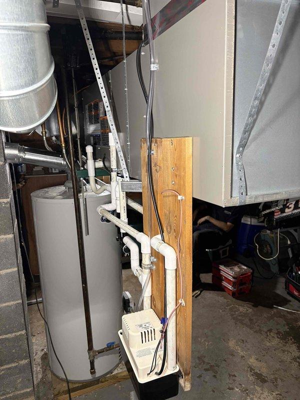 Completed full HVAC system installation including a 70,000 BTU gas furnace with humidifier and 2.5-ton air conditioning unit with matching evaporator coil configured for right-side positioning. Installed all necessary PVC venting, condensate drainage, refrigerant lines with foil-backed insulation, and supply/return ductwork connections in basement mechanical room. Reconnected all electrical components, verified proper system operation, and coordinated mechanical permit for installation compliance.