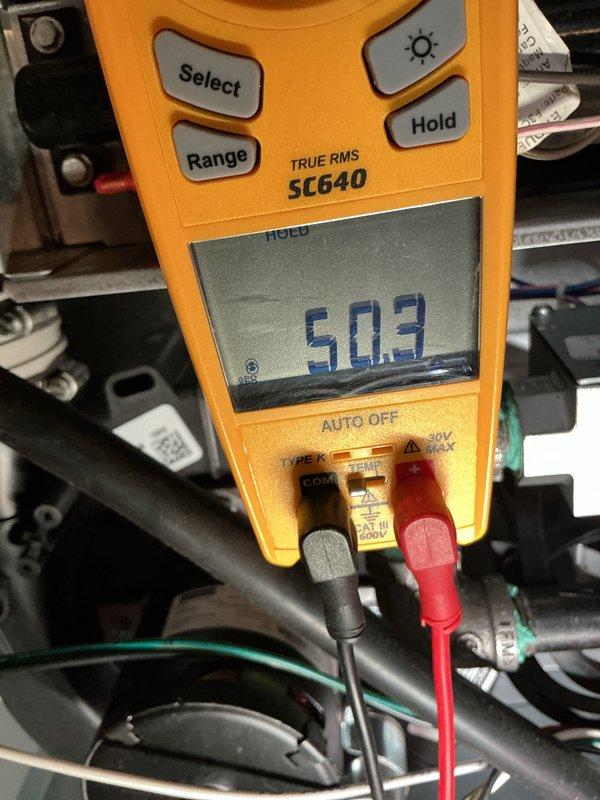 Performed comprehensive pre-winter tune-up and maintenance on residential HVAC system including both furnace and air conditioning unit. Conducted electrical diagnostics using digital multimeter to verify proper voltage readings of 503V and temperature measurements of 33.2°F at key system components, confirming all electrical connections and controls operating within manufacturer specifications. System inspected and found to be functioning properly with no issues identified; unit ready for heating season operation.