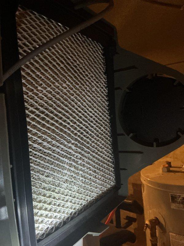 Completed routine maintenance on 5-year-old central air conditioning system and furnace. Inspected outdoor condenser unit, noting dirt and debris accumulation on heat exchanger coils; cleaned coils to restore optimal airflow and heat transfer efficiency. Replaced dirty pleated air filter to improve indoor air quality and system performance. All components operating within normal parameters upon completion of tune-up service.