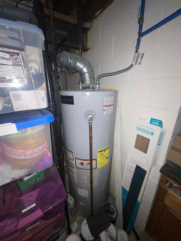 Provided estimate for replacement of 23-year-old natural gas furnace located in basement that is not operating properly. Assessed existing equipment configuration, venting system with PVC exhaust piping on exterior, and available space for new installation. Documented current system specifications and discussed replacement options with homeowner to restore reliable heating performance.