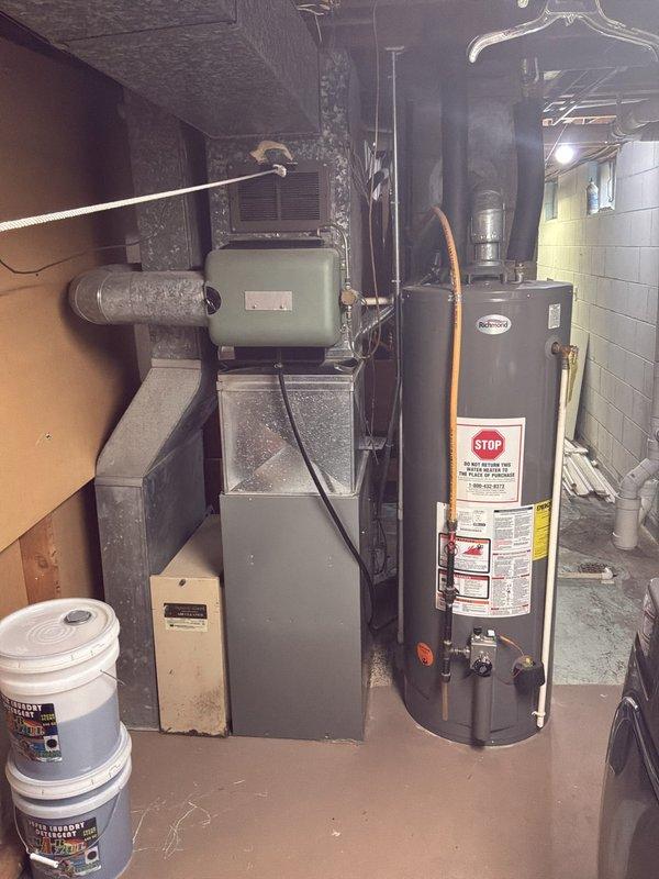 Conducted comprehensive HVAC system evaluation for basement-located equipment in ranch-style residence. Assessed existing non-operational furnace and air conditioning system for complete replacement options. Documented current installation configuration including natural gas furnace, ductwork layout, and associated mechanical components. Provided replacement estimates for both air conditioning unit only and complete furnace and air conditioning system package to address failed equipment.