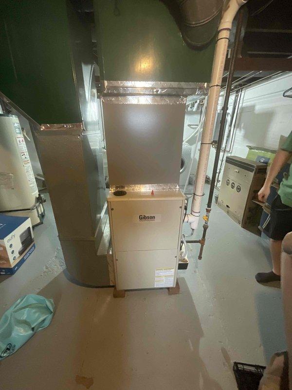 Provided comprehensive replacement estimate for non-operational Gibson furnace located in basement. Unit had previously been diagnosed by another contractor, with customer evaluating repair versus replacement options. Assessed existing natural gas forced-air heating system, documented current equipment configuration including ductwork connections and electrical service, and photographed installation for accurate equipment sizing and replacement planning.