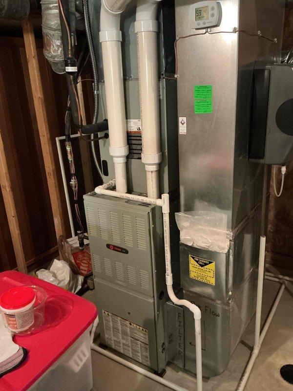 Responded to customer concern regarding non-functioning humidifier system. Performed diagnostic inspection of residential HVAC system including Trane furnace and associated IAQ equipment. Inspected humidifier unit for proper water supply, solenoid operation, and pad condition. Verified humidistat settings and control wiring connections. Checked water panel media for mineral buildup or deterioration that could prevent proper moisture distribution. Documented system configuration and current equipment condition with photos for service records.