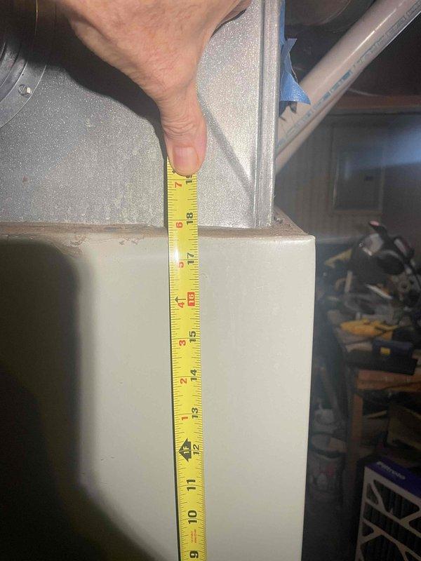 Provided estimate for complete furnace and air conditioning system replacement in basement location. Existing 25-year-old equipment assessed with air conditioning unit non-operational and furnace still functioning. Performed measurements of existing equipment and installation space to determine proper sizing and clearance requirements for new system installation.