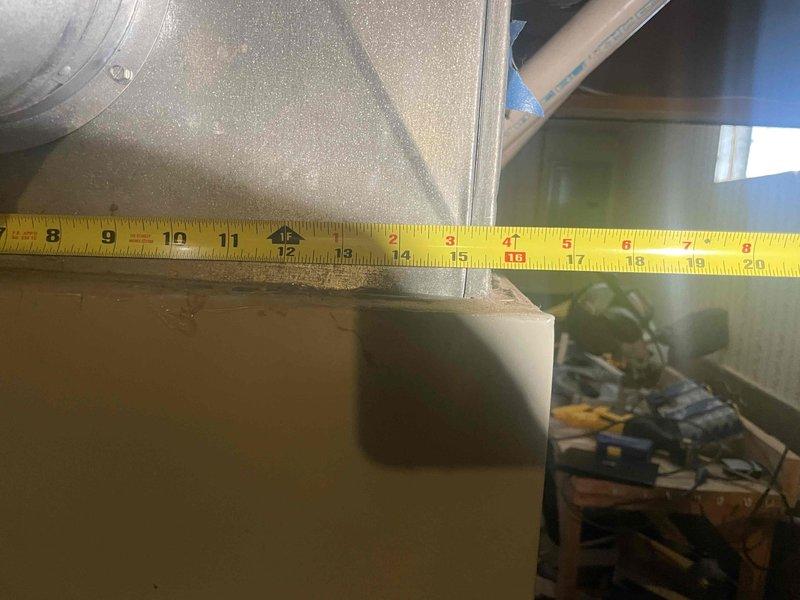Provided estimate for complete furnace and air conditioning system replacement in basement location. Existing 25-year-old equipment assessed with air conditioning unit non-operational and furnace still functioning. Performed measurements of existing equipment and installation space to determine proper sizing and clearance requirements for new system installation.