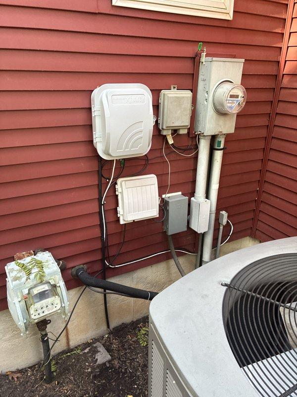 Conducted whole home generator estimate for residential property experiencing extended power outage impacting home office operations. Performed site assessment of existing 200-amp electrical service with digital meter, documented current utility connection configuration including meter base, service entrance conduit, and HVAC equipment placement on concrete pad. Evaluated installation requirements and discussed equipment options between Generac and Kohler generator systems to provide comprehensive backup power solution for critical telemedicine work needs.