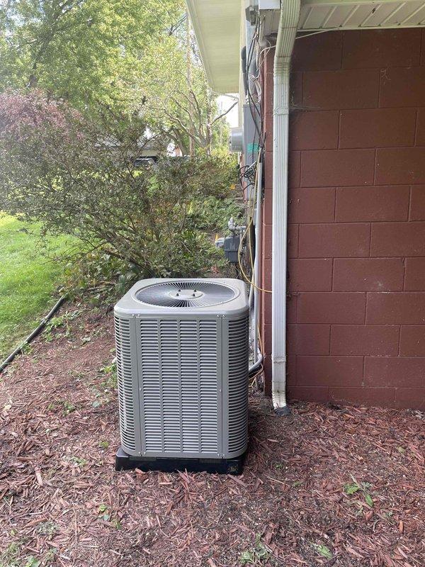 Completed mechanical-only installation of a 2-ton air conditioning system with evaporator coil on the right side of the residence. Installed new outdoor condenser unit on base pad against exterior wall with proper refrigerant line connections and electrical conduit routing. Mounted new evaporator coil with Bryant furnace system in basement mechanical room, connected all refrigerant lines with proper insulation, and installed necessary PVC condensate drainage piping. Reconnected all electrical components and verified proper system operation upon completion.