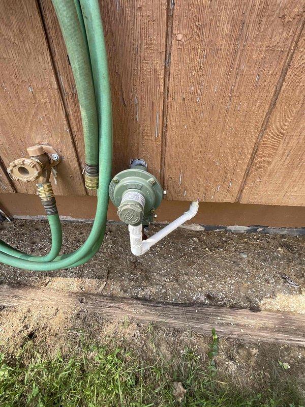 Completed electrical estimate for whole home generator installation at manufactured home property. Assessed site conditions including existing LP tank location, electrical meter placement, and available yard space with 75-foot side yards and 20-foot rear yard clearance. Provided comparative estimates for Generac and Kohler whole home generator systems as new installation, documenting utility locations and optimal generator placement for code compliance and efficient operation.