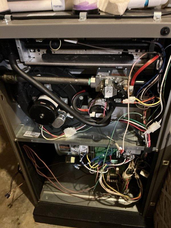 Completed comprehensive annual maintenance on a 4-year-old furnace located in basement as part of the ComfortGuard Maintenance Package. Performed full system inspection, including examination of blower motor assembly, gas valve components, control board, and all electrical connections. Verified proper operation of all safety controls and burner assembly. Cleaned and inspected heat exchanger surfaces. Checked and documented all wire harnesses and connections for signs of wear or damage. Replaced 20x25x5 HVAC air filter with AirDefender brand filter to maintain optimal airflow and system efficiency. Tested system startup and shutdown sequences, confirmed proper flame characteristics, and verified temperature rise across heat exchanger within manufacturer specifications. All components found to be in good working condition with no issues identified. Unit operating efficiently and safely.