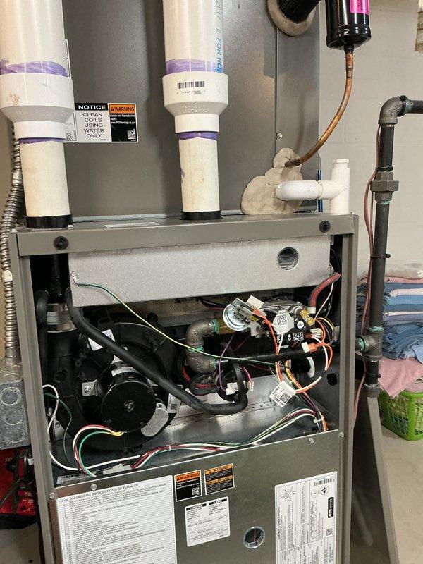 Completed annual HVAC maintenance on residential furnace system. Performed comprehensive inspection of all internal components including blower motor assembly, gas valve, control boards, electrical connections, and refrigerant lines. Cleaned and replaced air filter, verified proper operation of condensate drain lines, and confirmed all safety labels and warning stickers were intact and legible. All systems tested and operating within normal parameters.