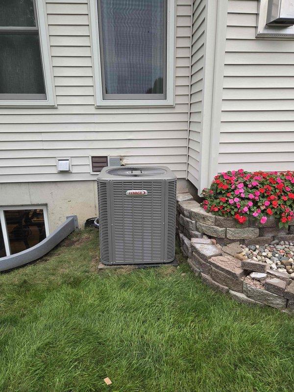 Completed full HVAC system installation including 70,000 BTU furnace, 3-ton air conditioning condenser unit, and evaporator coil. Installed Lennox brand condenser unit in rear yard with proper placement on foundation pad adjacent to residential structure. Mounted air handler unit vertically in basement utility area with secure attachment to interior wall framing. Ran refrigerant lines with proper insulation from outdoor condenser to indoor coil assembly. Installed white PVC condensate drain line with appropriate slope and trap configuration, including condensate pump for proper drainage. Connected all electrical components per code requirements. Verified all mechanical and electrical connections for proper operation. System tested and confirmed operational upon completion of installation.