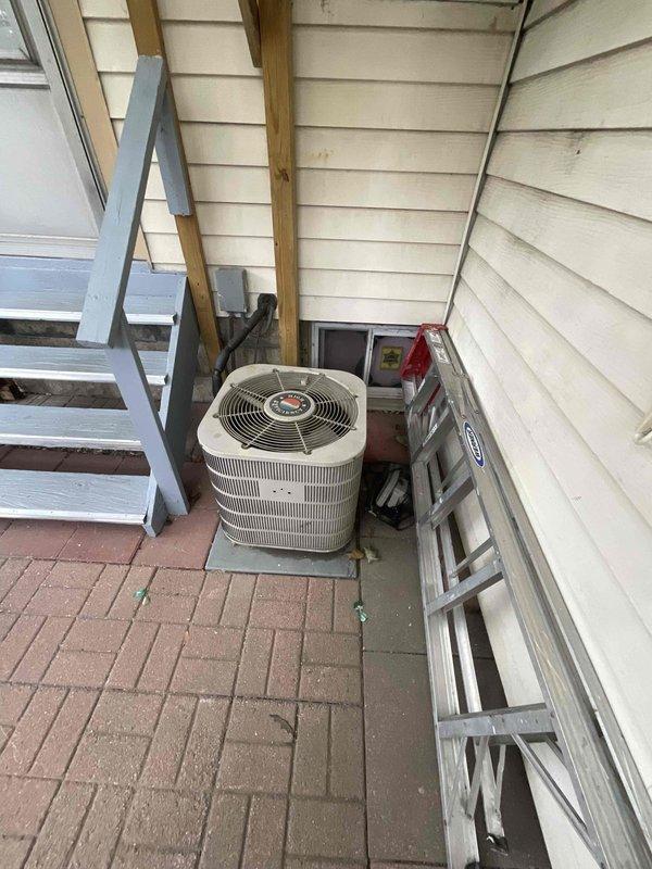 Conducted comprehensive site evaluation for complete HVAC system replacement at residential property. Assessed existing outdoor condensing unit located on brick paver patio against exterior wall and evaluated basement mechanical room with existing ductwork infrastructure. Documented current equipment conditions, measured installation clearances, reviewed electrical service accessibility, and provided detailed replacement options with equipment specifications suitable for the home's heating and cooling requirements.