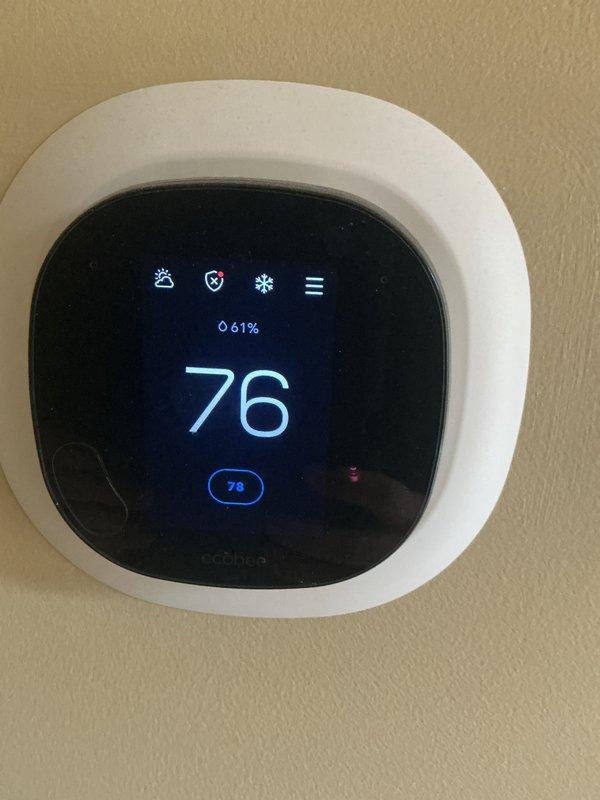 Completed comprehensive annual maintenance on a four-year-old furnace and air conditioning system under ComfortGuard Maintenance Package. Performed full AC tune-up including refrigerant level verification, condenser coil inspection and cleaning, electrical connection testing, and airflow measurements. Inspected air handler unit, verified proper filter installation, tested thermostat operation and calibration on ecobee digital control system, and confirmed all safety controls functioning within manufacturer specifications. Both heating and cooling systems operating efficiently with no deficiencies noted; all components passed inspection criteria.