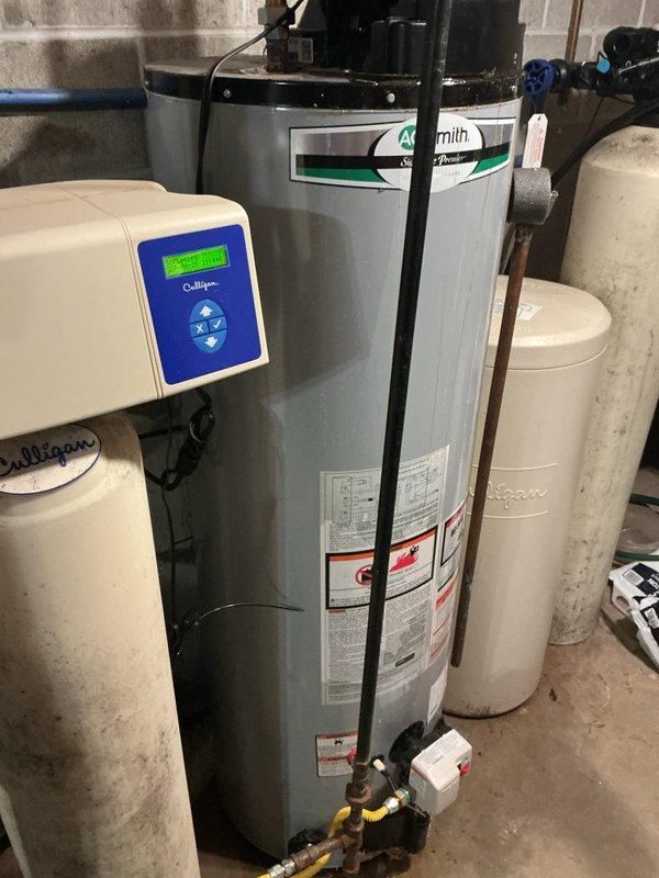 Responded to service call for A.O. Smith tanked water heater experiencing leaking at cold water intake nipples and gas valve fault signal resulting in no hot water production. Upon inspection, identified active water leakage at the cold water inlet connection causing moisture intrusion into the gas control valve system, triggering safety fault code. Assessed integrity of threaded pipe connections and determined intake nipple required resealing. Shut down gas supply and water feed to unit. Drained water heater tank to safe working level. Removed compromised cold water inlet nipple, cleaned threaded connections, applied appropriate thread sealant and Teflon tape, and reinstalled with proper torque specifications to manufacturer standards. Verified all connections for water-tight seal. Refilled tank, purged air from system, and restored gas supply. Reset gas control valve, relit pilot light, and verified burner ignition sequence. Monitored unit through complete heating cycle to confirm pr