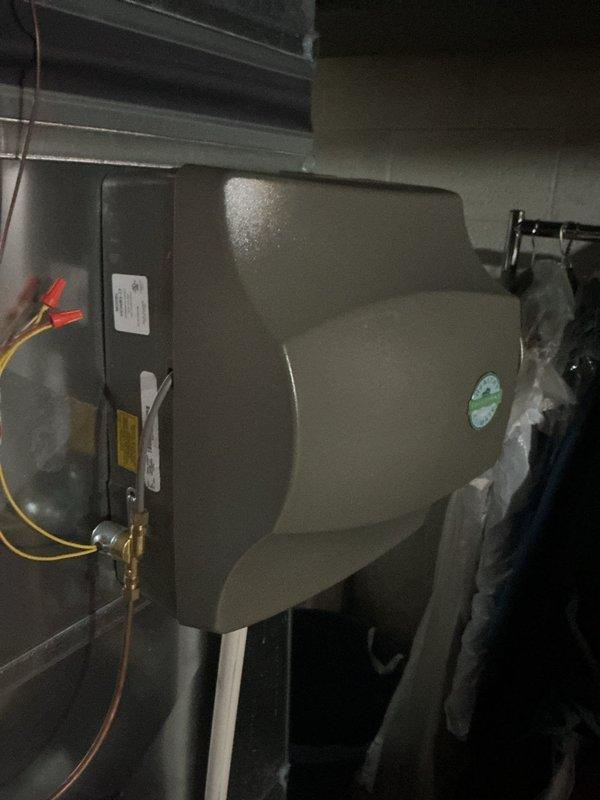 Completed comprehensive ComfortGuard Maintenance Package on residential HVAC system, including inspection and servicing of Lennox heating equipment with integrated humidification system. Verified proper operation of digital thermostat displaying accurate temperature readings at 75°F with system functioning in heat-only mode, and confirmed humidifier unit connections including electrical wiring and copper supply lines were secure and operational.