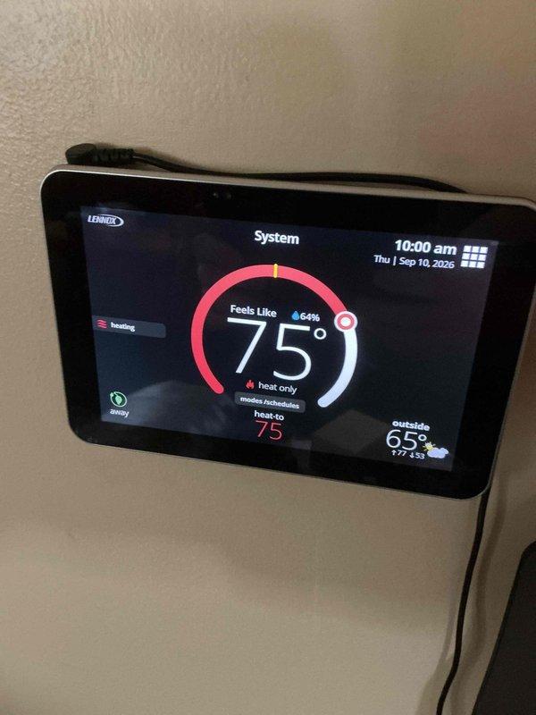 Completed comprehensive ComfortGuard Maintenance Package on residential HVAC system, including inspection and servicing of Lennox heating equipment with integrated humidification system. Verified proper operation of digital thermostat displaying accurate temperature readings at 75°F with system functioning in heat-only mode, and confirmed humidifier unit connections including electrical wiring and copper supply lines were secure and operational.