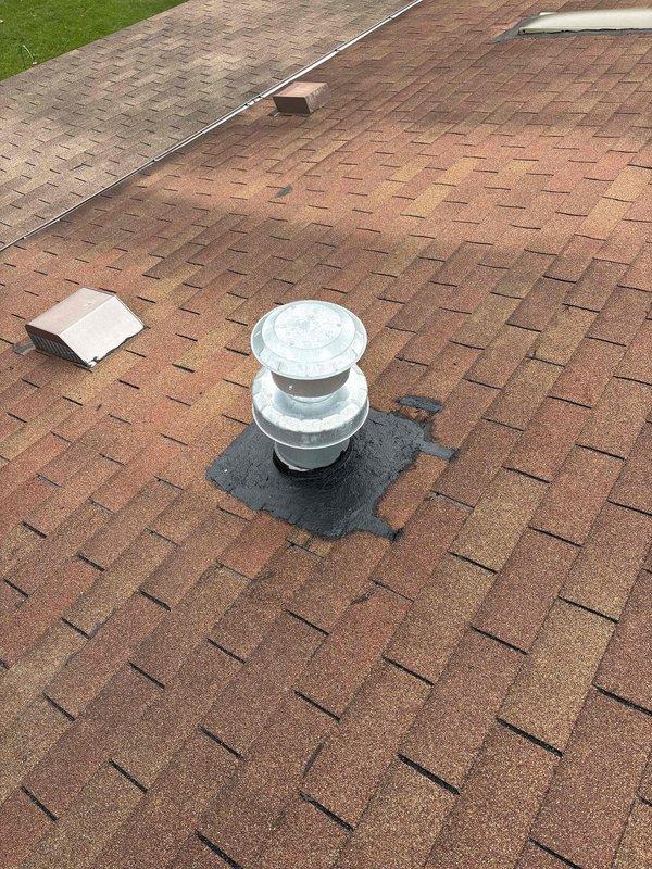 Responded to callback for potential leak at roof jack seal around flashing and swivel joint following recent installation of 77K BTU furnace, 3-ton air conditioning unit, and evaporator coil. Inspected roof penetrations and vent pipe flashing for signs of water intrusion or compromised seals. Documented condition of metal roof jack, galvanized vent pipe, and surrounding shingle interface with photographic evidence showing current state of roof penetrations and flashing installations.