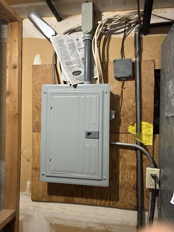 Provided comprehensive estimate for complete HVAC system replacement including 24-year-old furnace located in basement and air conditioning unit positioned outside. Assessed existing electrical panel configuration and circuit capacity to ensure compatibility with new equipment installation, documented current breaker arrangement including dedicated circuits for furnace and AC unit, and evaluated utility space layout for proper equipment placement and clearances.