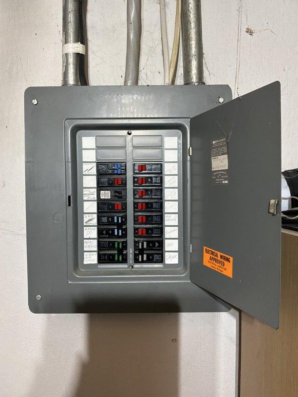Conducted on-site assessment of existing basement-installed furnace and air conditioning system to provide replacement estimate. Evaluated current operational equipment, documented aging HVAC infrastructure including furnace unit with vertical ductwork configuration, and assessed electrical panel capacity for new system installation requirements.