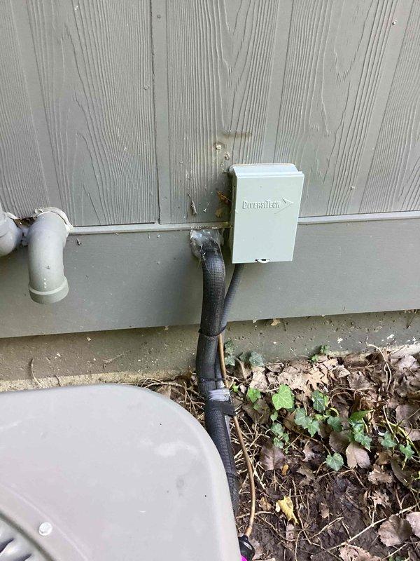 Responded to callback regarding line set penetration seal on recently installed 2.5 ton A/C system and evaporator coil. Inspected exterior wall penetration where refrigerant lines enter structure and verified proper sealing around line set entry point. Confirmed penetration is adequately sealed with no gaps or openings that would allow air infiltration or pest entry.