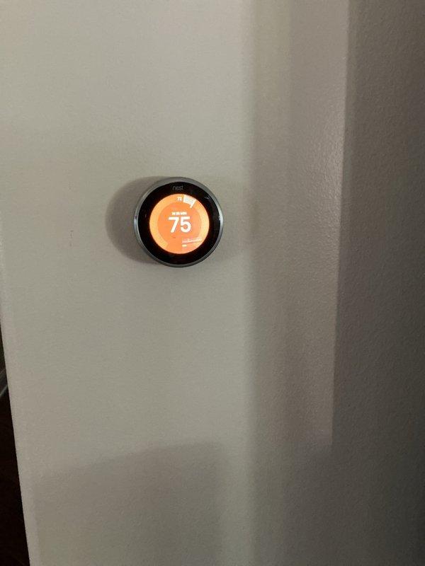 Completed preventive maintenance inspection on residential HVAC system. Verified thermostat operation displaying 75°F in heating mode, inspected furnace components including gas valve assembly, blower motor, and electrical connections, and noted filter may require replacement at next service interval.