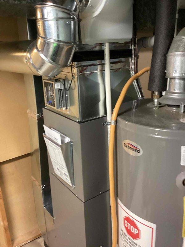 Completed full HVAC system installation including a 70,000 BTU furnace, 2-ton air conditioning unit with matching evaporator coil, and humidifier. Installed new outdoor condenser unit on concrete pad in rear yard with proper electrical disconnect and refrigerant line connections. Mounted furnace in mechanical room with complete ductwork integration and reconnected all necessary utilities. All equipment installed per manufacturer specifications and local mechanical permit requirements, with system tested and operational upon completion.