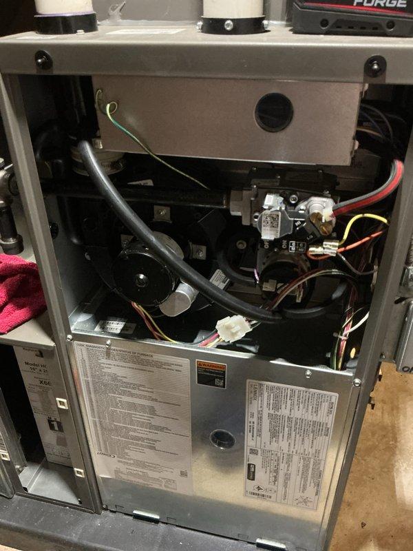 Completed annual heating maintenance on residential forced air furnace system. Performed comprehensive inspection of all internal components including blower motor assembly, gas valve, electrical connections, and control systems. Verified proper operation of ignition system and heat exchanger integrity. Inspected and documented condition of wiring harnesses, flexible ductwork connections, and safety controls. All manufacturer labels and specifications verified as legible and intact. System tested and confirmed operational within normal parameters. Unit left in safe and proper working condition for the heating season.