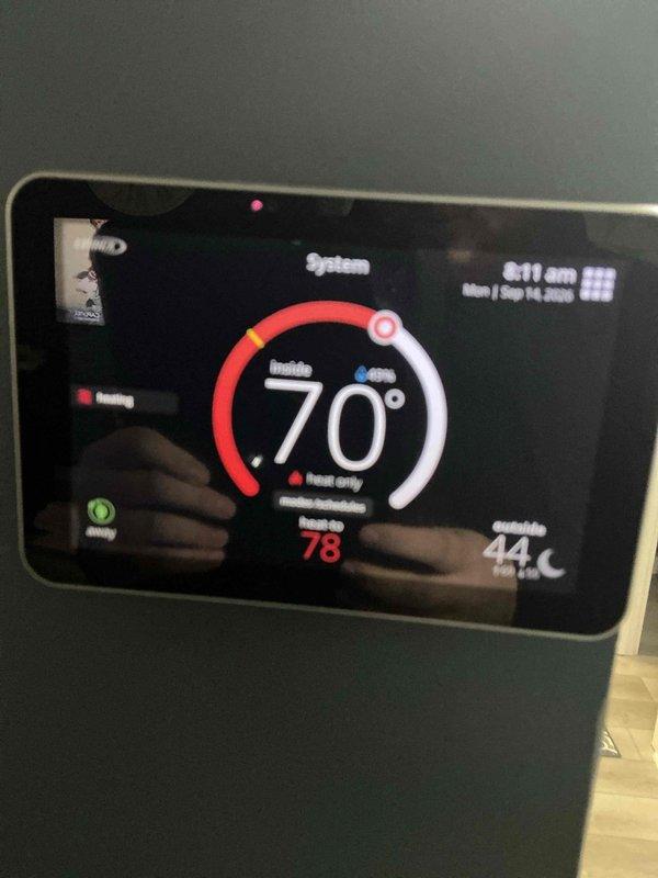 Completed comprehensive ComfortShield Maintenance Package including system inspection, filter replacement with MERV 11 HCF20-11 media filter, and thermostat functionality verification. Confirmed heating system operational status with proper temperature differential between indoor setpoint of 70°F and ambient conditions, and documented smart thermostat display showing correct system communication and control functions.