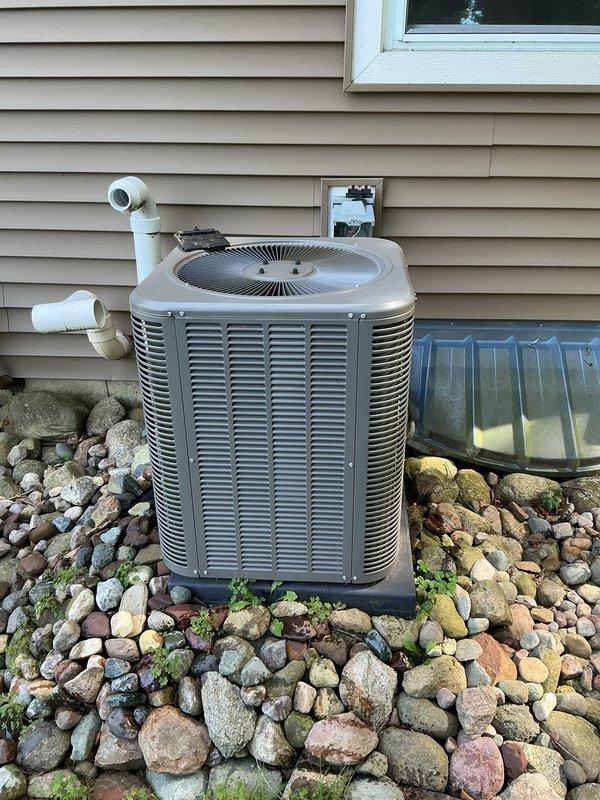 Responded to service call for air conditioning unit repeatedly tripping breaker every four days. Upon inspection, discovered significant debris and insulation fiber buildup in drain system components. Removed and cleaned clogged drain assembly, clearing yellow insulation fibers and accumulated dirt from ports and passages. Verified proper drainage flow, inspected condenser unit exterior condition, and tested system operation. Unit running properly at time of departure with breaker reset and holding under normal load.