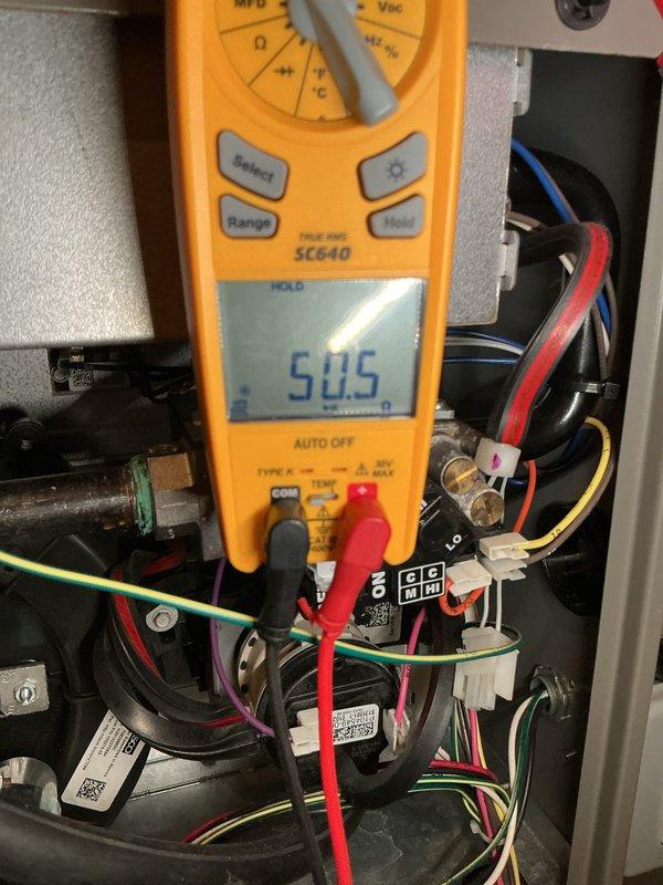 Completed annual HVAC maintenance on air handling unit, including system diagnostics and electrical testing. Replaced air filters and evaporative cooler pads as needed, verified proper system operation with readings showing 50.5 on electrical components, and documented equipment condition with photos for service records.