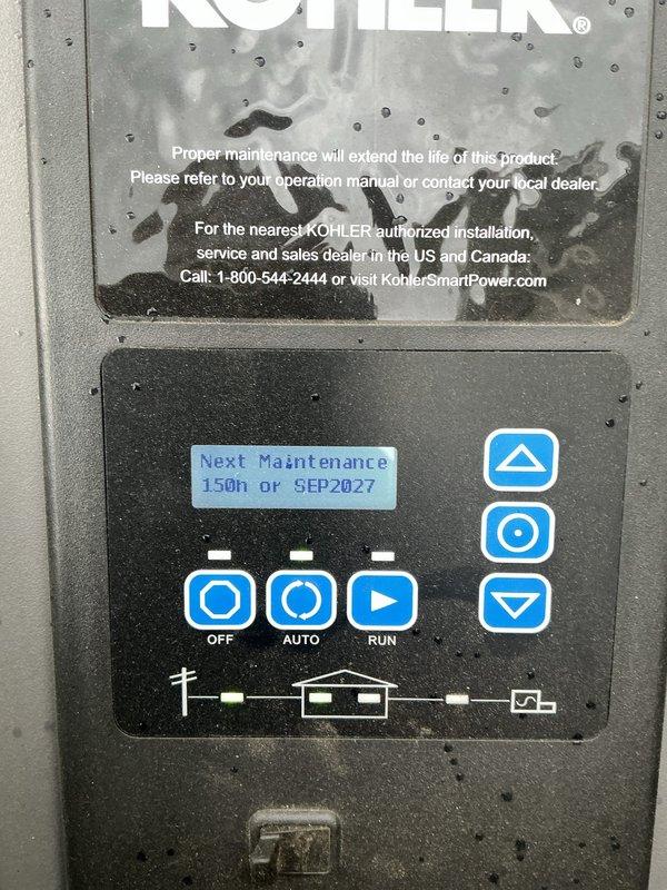 Completed scheduled maintenance on a 20kW Kohler generator system. Performed comprehensive inspection of electrical components, verified battery connections and security strap integrity, confirmed control panel functionality with digital display reading operational parameters, and validated automatic transfer switch operation. Unit tested successfully in AUTO and RUN modes with next maintenance interval properly displayed as 150 hours or September 2027.