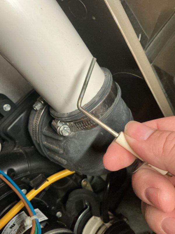 Completed scheduled air handler maintenance inspection. Tightened condensate drain line connections and hose clamps on PVC piping to ensure proper seal and prevent potential leaks. All system components inspected and found operating within normal parameters.