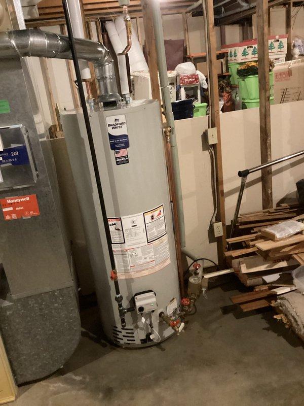 Completed installation of 50-gallon tanked water heater (model RG250T6N) in basement utility area. Connected unit to existing copper supply lines, installed proper pressure relief valve, and verified all plumbing connections for code compliance. Permit was obtained prior to installation, and all work was performed according to manufacturer specifications and local plumbing regulations.