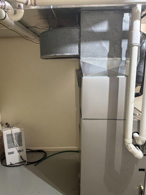Responded to service call for 2015 Bryant furnace experiencing abnormal noises and inadequate heating following lightning strike. Conducted comprehensive system evaluation of basement-installed Bryant Plus 90i furnace and associated air handler components. Assessed electrical systems, control boards, and operational functionality to determine extent of lightning damage. Provided detailed estimate for complete HVAC system replacement including furnace, air handler, ductwork connections, and associated components to restore proper heating and cooling operation to the residence.