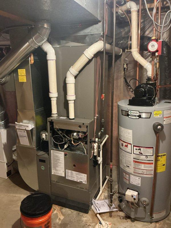 Completed annual cooling maintenance on residential HVAC system. Performed comprehensive inspection of furnace and air handler components, verified proper operation of blower motor assembly, checked electrical connections and wiring harnesses, and inspected condensate drainage system with PVC piping. All components found operating within normal parameters with no issues identified during routine maintenance visit.