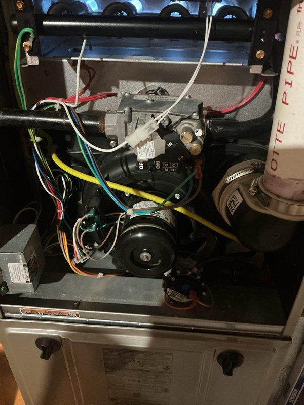 # Annual HVAC Maintenance Completed

Performed comprehensive annual cooling maintenance on residential air conditioning system as part of preventative maintenance program. Conducted thorough inspection of outdoor condensing unit and indoor air handler components to ensure optimal system performance for the upcoming cooling season.

Inspected gas furnace burner assembly and verified proper ignition sequence with clean blue flame pattern across all burners. Examined heat exchanger for signs of corrosion or cracking. Evaluated furnace control board and electrical connections, confirming all wire terminations were secure and properly seated in connector blocks. Verified all safety switches and limit controls were functioning correctly.

Checked condensate drain system including drain pan, trap, and discharge lines for proper drainage and blockages. Inspected blower motor assembly and verified proper operation. Examined all visible wiring harnesses for signs of wear, overheating, or loose c