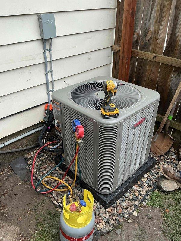 Completed full HVAC system installation including new Goodman ELZVXAV045DVEXBR furnace and ML14CT1-018-230 air conditioning unit. Installed outdoor condensing unit on rubber pad with proper refrigerant line connections, mounted electrical conduit and junction box, ran 3/4" PVC drain lines, and installed MERV 13 filter media. System charged, tested, and commissioned with all electrical connections completed including breaker installation and proper disconnects.