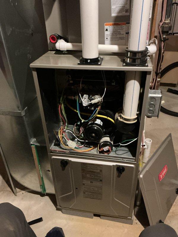 Completed annual preventative maintenance on Bryant residential HVAC system including both heating and cooling components. Performed comprehensive inspection of furnace unit, verified heat exchanger integrity and burner operation, checked blower motor function and electrical connections, inspected PVC venting system for proper drainage and exhaust flow, and replaced air filters. Tested system operation under heating mode with visible ignition sequence, confirmed all safety controls functioning properly, and verified proper airflow throughout the system. Unit operating within manufacturer specifications with no issues identified.