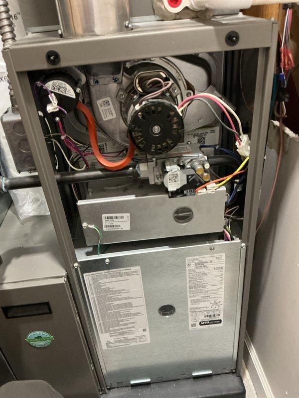 Completed annual heating maintenance on residential gas furnace system. Performed comprehensive inspection with front access panel removed to evaluate all internal components including blower motor assembly, gas valve, electrical connections, and control systems. All wire harnesses, connections, and safety controls were inspected and found in proper working condition. Blower motor and wheel assembly verified operational with no unusual wear or damage observed. Gas valve and associated fittings checked for proper operation and integrity. Unit returned to normal operating condition with all access panels secured.