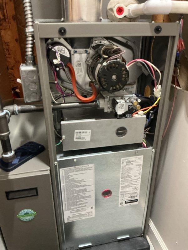 Completed annual heating maintenance on residential gas furnace system. Performed comprehensive inspection with front access panel removed to evaluate all internal components including blower motor assembly, gas valve, electrical connections, and control systems. All wire harnesses, connections, and safety controls were inspected and found in proper working condition. Blower motor and wheel assembly verified operational with no unusual wear or damage observed. Gas valve and associated fittings checked for proper operation and integrity. Unit returned to normal operating condition with all access panels secured.