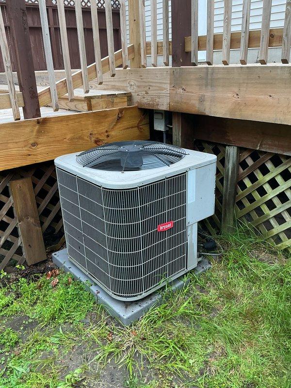 Completed installation of AprilAire M600 whole-home humidifier with connection to existing ductwork and water supply line. Performed annual heating and cooling maintenance on HVAC system, including inspection of outdoor condensing unit positioned beneath deck structure. Conducted water heater maintenance service to ensure proper operation and safety of all equipment.