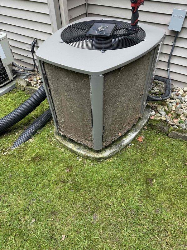 Completed comprehensive ComfortGuard maintenance package on residential split system HVAC unit. Performed electrical diagnostics using digital multimeter to verify system voltage and amperage readings, inspected outdoor condenser unit including fan operation and refrigerant line connections, and replaced air filter as requested. Unit showed normal wear consistent with age but all components functioning within specifications at time of service.