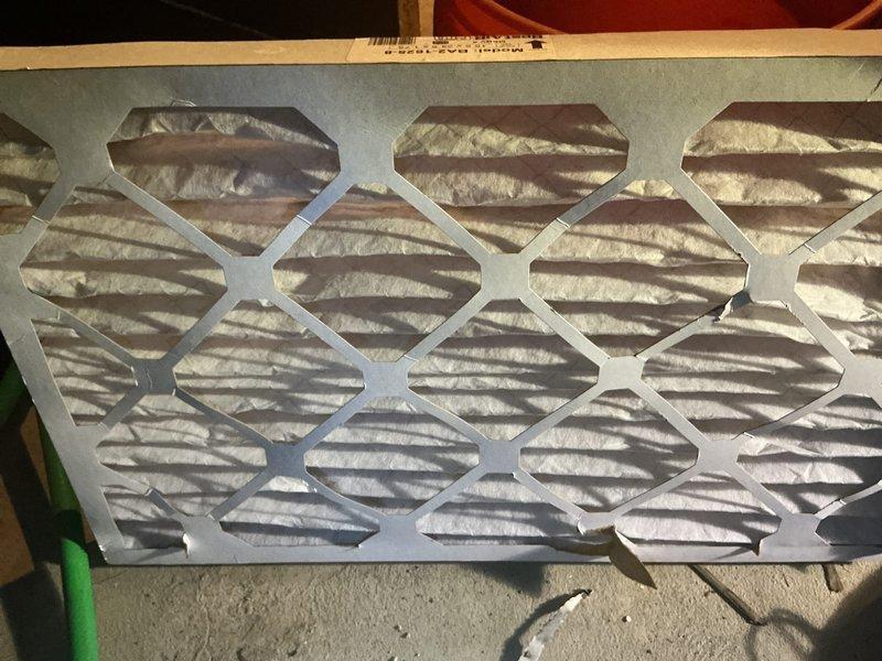 Completed annual heating maintenance on residential HVAC system. Inspected and photographed air filter showing moderate dust accumulation on pleated media within metal frame, indicating normal operation since last service. Examined furnace components including heat exchanger, blower assembly, and PVC condensate drainage system with SCH 40 piping; verified proper installation and sealing of ductwork connections with all components operating within normal parameters.