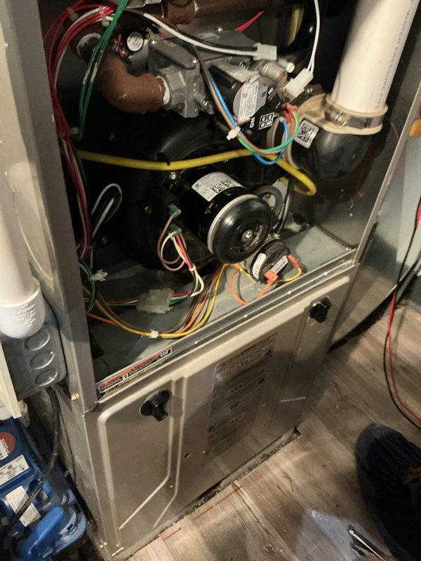 Completed comprehensive HVAC maintenance inspection on residential forced air system. Accessed interior compartment to inspect blower motor assembly, electrical connections, and pressure controls; all components found operating within normal parameters. Removed and inspected air filter which showed moderate dust accumulation; filter remains serviceable but should be monitored for replacement at next service interval.