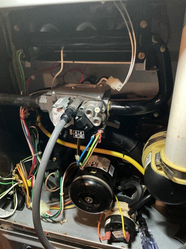 Completed annual HVAC maintenance inspection on gas furnace system. Performed comprehensive evaluation of burner assembly, gas valve, electrical connections, and blower motor components. Verified proper ignition with blue flame pattern across all burner ports, inspected gas valve controls and associated wiring harnesses, and confirmed all mechanical and electrical components operating within normal parameters. System tested and left in proper working condition.