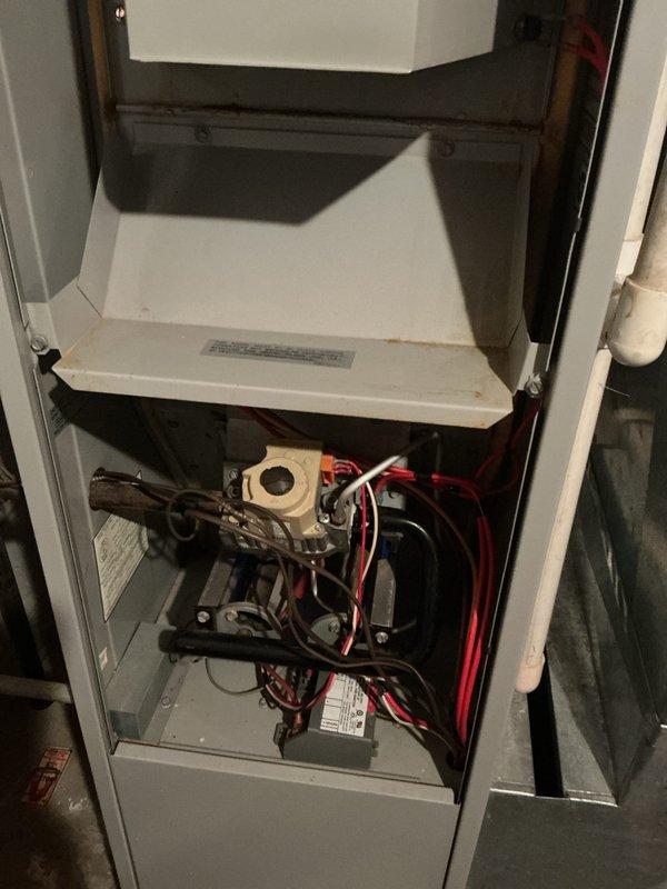 Completed annual HVAC maintenance on residential heating and cooling system. Inspected and serviced furnace unit including blower motor, gas valve assembly, electrical connections, and wiring; verified thermostat operation and calibration. All components found to be in functional condition with routine maintenance performed per manufacturer specifications.