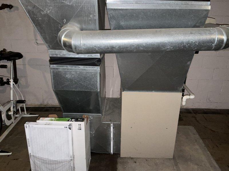 Provided estimate for replacement of 20+ year old natural gas furnace and air conditioning system located in basement. Current equipment is operational but has reached end of expected service life. Evaluated existing ductwork configuration and utility connections to determine appropriate replacement specifications.